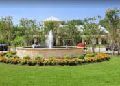 Thumbnail 1 of 30 - a fountain in the middle of a park