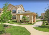 Thumbnail 2 of 30 - an image of a house with a sidewalk in front of it