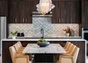 Thumbnail 5 of 44 - a kitchen with a marble table and chairs  at The Clearing at ONE28, Olathe, KS, 66062