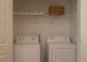Thumbnail 19 of 44 - a laundry room with two washes and a dryer  at The Clearing at ONE28, Olathe, Kansas