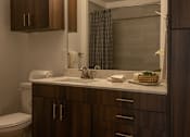 Thumbnail 23 of 44 - a small bathroom with a sink and a toilet  at The Clearing at ONE28, Olathe, KS, 66062