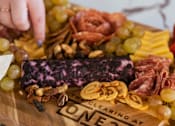 Thumbnail 7 of 44 - a board of cured meats and cheese on a cutting board at The Clearing at ONE28, Kansas
