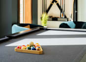 Thumbnail 43 of 44 - a pool table in a room with a tray of balls at The Clearing at ONE28, Kansas