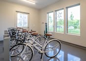 Thumbnail 39 of 44 - a row of bikes parked in a room at The Clearing at ONE28, Kansas