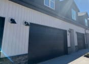 Thumbnail 30 of 36 - a large white house with a garage door at Hillcrest Village, Springdale