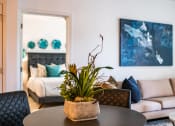 Thumbnail 27 of 42 - Living room with cream couch at The Villas at Waterside, Lenexa