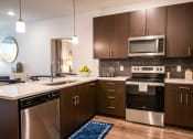 Thumbnail 22 of 42 - Kitchen with appliances at The Villas at Waterside, Kansas
