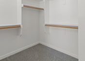 Thumbnail 33 of 36 - walk in closet with carpet at Hillcrest Village, Springdale Arkansas