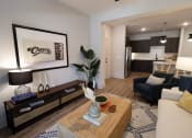 Thumbnail 25 of 60 - a living room with a couch and a coffee table at The Crest at South Point Apartments, Georgia
