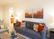 Thumbnail 15 of 44 - A living room with a grey couch and a painting on the wall. at The Crest at Sugarloaf, Georgia, 30044