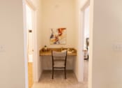 Thumbnail 18 of 44 - A room with a desk and a chair. at The Crest at Sugarloaf, Lawrenceville, 30044