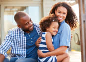 Thumbnail 56 of 60 - happy family sitting on a bench in front of their house at The Crest at South Point, McDonough, GA