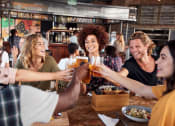 Thumbnail 55 of 60 - a group of people sitting around a table drinking beer at The Crest at South Point, McDonough Georgia