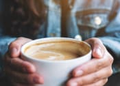 Thumbnail 53 of 60 - a woman holding a cup of coffee at The Crest at South Point, McDonough