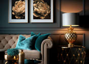 Thumbnail 63 of 66 - a living room with a couch and two paintings on the wall at District at Riverside Apartments, Chattanooga, 37406