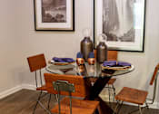 Thumbnail 8 of 27 - a dining room with a table and chairs at The Crest at Laurel Canyon Apartments, Canton, GA