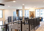 Thumbnail 30 of 66 - A black metal railing in a spacious room with a painting hanging on the wall.at Riverside Apartments, Chattanooga, TN