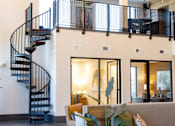 Thumbnail 28 of 66 - A living room with a spiral staircase.at Riverside Apartments, Chattanooga, Tennessee