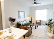 Thumbnail 5 of 66 - A dining room with a white table and chairs.