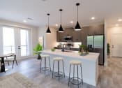 Thumbnail 46 of 66 - District at riverside brand new apartment community located in Chattanooga, TN kitchen design with quartz countertops and stainless steel appliances