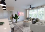Thumbnail 47 of 66 - District At Riverside Apartment Home Living Space with ceiling fan, open concept, and large windows in Chattanooga, TN