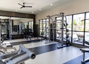 Thumbnail 22 of 30 - Fitness center with cable machines and free weights at The Crest at Acworth Apartments, Georgia, 30102
