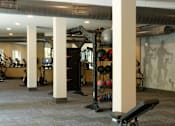 Thumbnail 35 of 66 - A gym with a variety of equipment including weights and exercise machines.at Riverside Apartments, Chattanooga, 37406