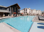 Thumbnail 19 of 54 - a large swimming pool with apartments in the background at The Crest at Acworth, Georgia
