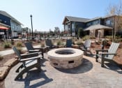 Thumbnail 18 of 54 - an outdoor fire pit with chairs and a house in the background at The Crest at Acworth, Acworth, GA, 30102