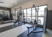 Thumbnail 23 of 54 - a gym with exercise equipment and windows in a building at The Crest at Acworth, Acworth, 30102