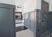 Thumbnail 25 of 54 - a long hallway with gray doors and a black and white rug and a hall way at The Crest at Acworth, Acworth, 30102