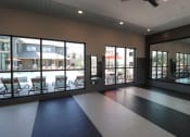 Thumbnail 27 of 54 - the lobby of a building with large windows and a black and white tile floor at The Crest at Acworth, Acworth, GA