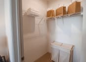 Thumbnail 5 of 54 - a walk in closet in a small room with boxes on the shelf and a white at The Crest at Acworth, Acworth, GA, 30102