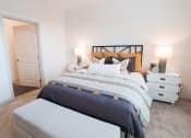 Thumbnail 7 of 54 - a bedroom with a bed and two night stands and a closet at The Crest at Acworth, Acworth