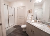 Thumbnail 2 of 54 - a bathroom with a toilet sink and shower at The Crest at Acworth, Acworth, GA