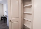 Thumbnail 6 of 54 - the door to the closet is open and the shelves are empty at The Crest at Acworth, Georgia, 30102
