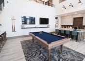 Thumbnail 40 of 54 - a pool table in a living room with a bar and a television at The Crest at Acworth, Georgia