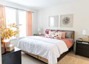 Thumbnail 5 of 30 - Bedroom with pink accents and neutral decor at The Crest at Acworth Apartments, Acworth, GA