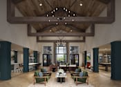 Thumbnail 5 of 5 - A large room with a wooden ceiling and a chandelier hanging from it.