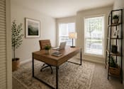 Thumbnail 20 of 40 - A room with a desk and a chair.