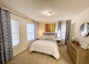 Thumbnail 16 of 40 - The Crest at Berkeley Lake model apartment bedroom with walk-in closet located in Duluth,GA