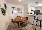 Thumbnail 15 of 40 - The Crest at Berkeley Lake model apartment dining space located in Duluth, GA 30096