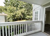 Thumbnail 8 of 40 - The Crest at Berkeley Lake St James renovated concrete patio with wooded view located in Duluth, GA 30096