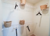 Thumbnail 6 of 33 - Apartment home walk-in closet with shelving located in Naples,FL at The Crest at Naples, Florida