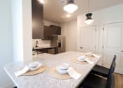 Thumbnail 5 of 60 - Kitchen with Barstool Seating at The Crest at South Point Apartments, McDonough, 30253