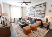 Thumbnail 13 of 46 - The Wren 1 bedroom model apartment home living space with oversized windows located in Lawrenceville,GA