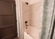 Thumbnail 9 of 46 - The Wren 1 bedroom model apartment home bathroom with soaking tub located in Lawrenceville,GA