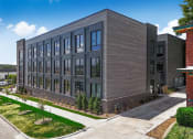 Thumbnail 2 of 18 - a large building with a sidewalk in front of it