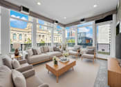Thumbnail 2 of 8 - A living room with a large window overlooking a cityscape.