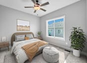 Thumbnail 9 of 12 - A bedroom with a large bed, a ceiling fan, and a window with a view of a house.